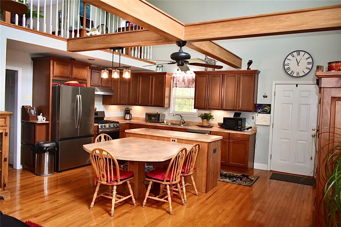 Image 3: Abundant cabinetry with a convenient central islan