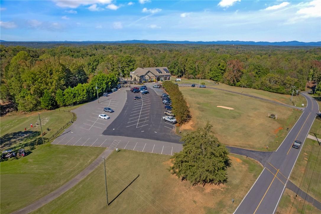 Image 3: Vast green spaces and a private parking area provi