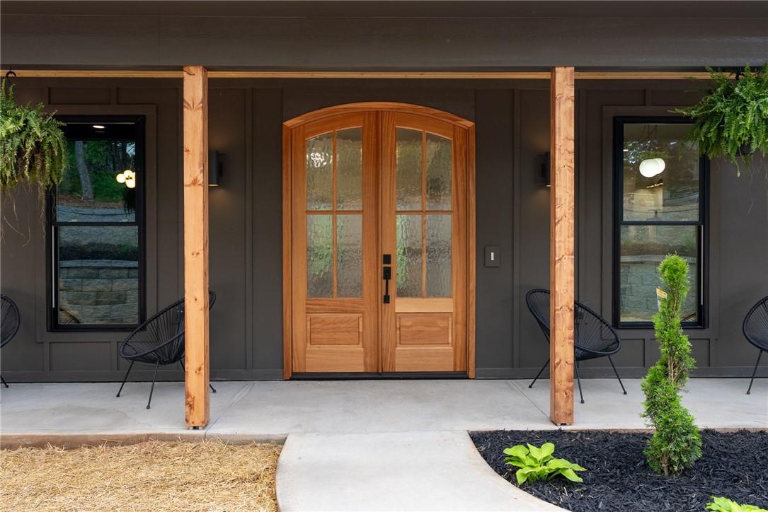 Image 4: This inviting entryway features a welcoming porch,