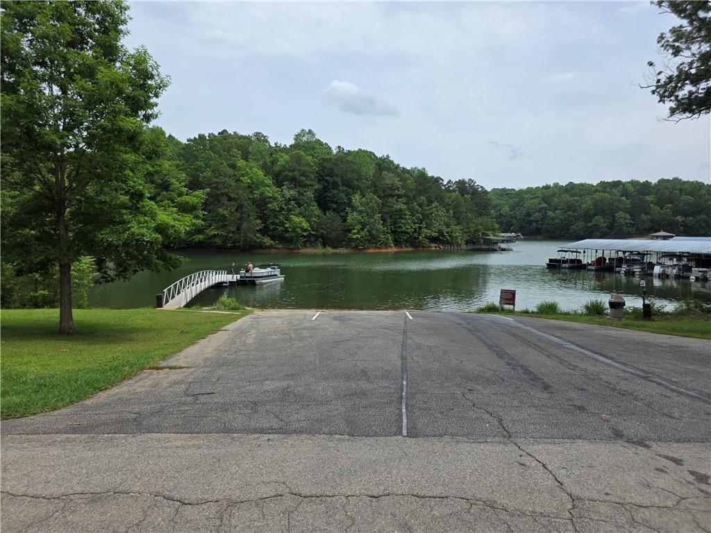 Image 2: A boat ramp leads into a serene lake.