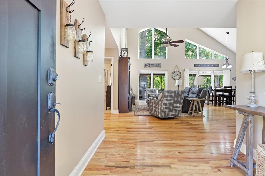 Image 3: Hardwood floors guide you through this inviting op