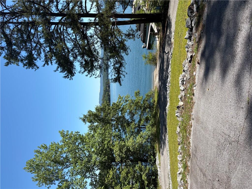 Image 1: A tranquil lakefront setting offers an idyllic esc