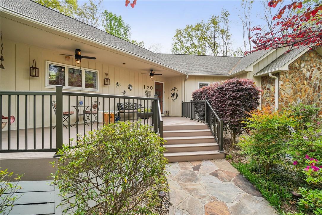 Image 3: This inviting home features a charming exterior wi