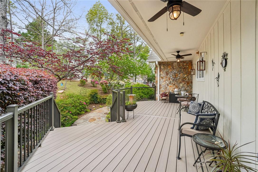 Image 4: This inviting outdoor deck offers tranquil views o