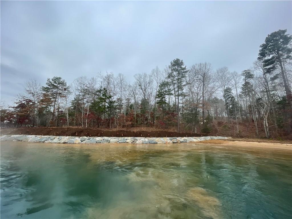 Image 2: This serene lakefront property offers picturesque