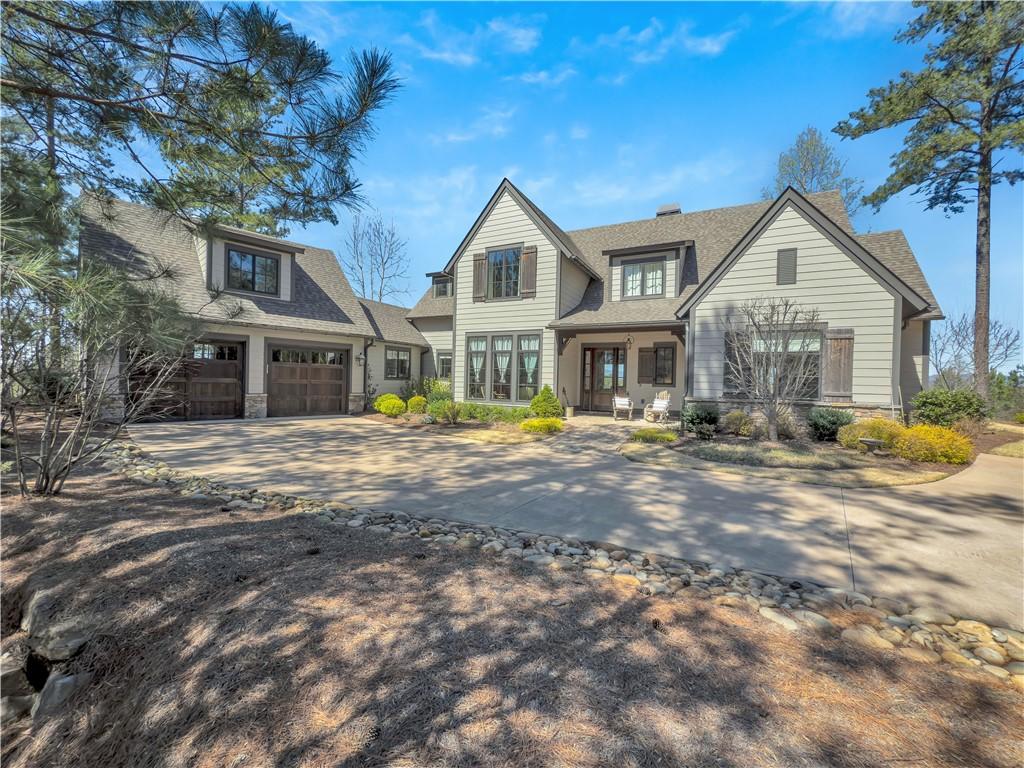 Image 1: This charming home features a welcoming entrance a