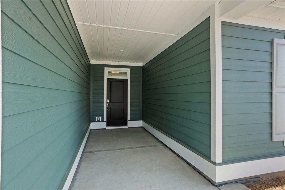 Image 3: A welcoming covered entry provides shelter, leadin