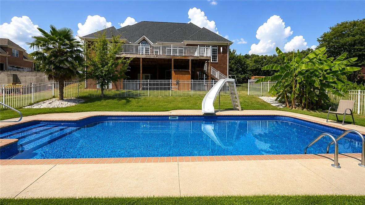 Image 2: An inviting backyard oasis offers a pristine ingro