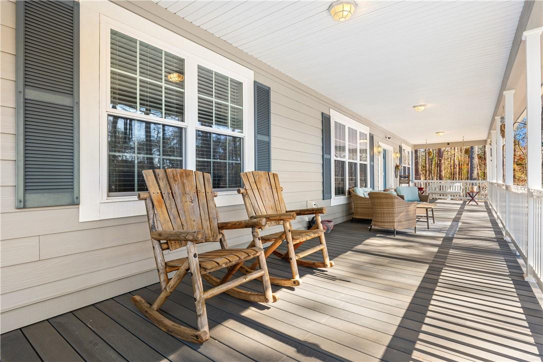 Image 4: Relax on this expansive porch, perfect for enjoyin