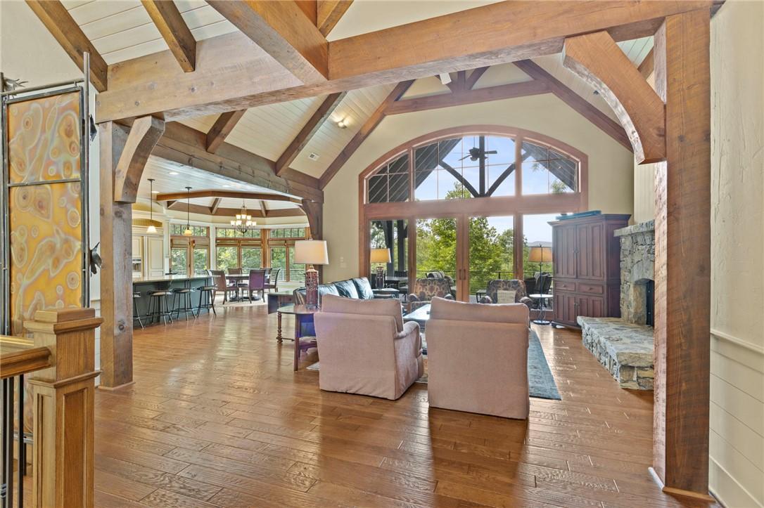 Image 4: A grand great room features soaring vaulted ceilin