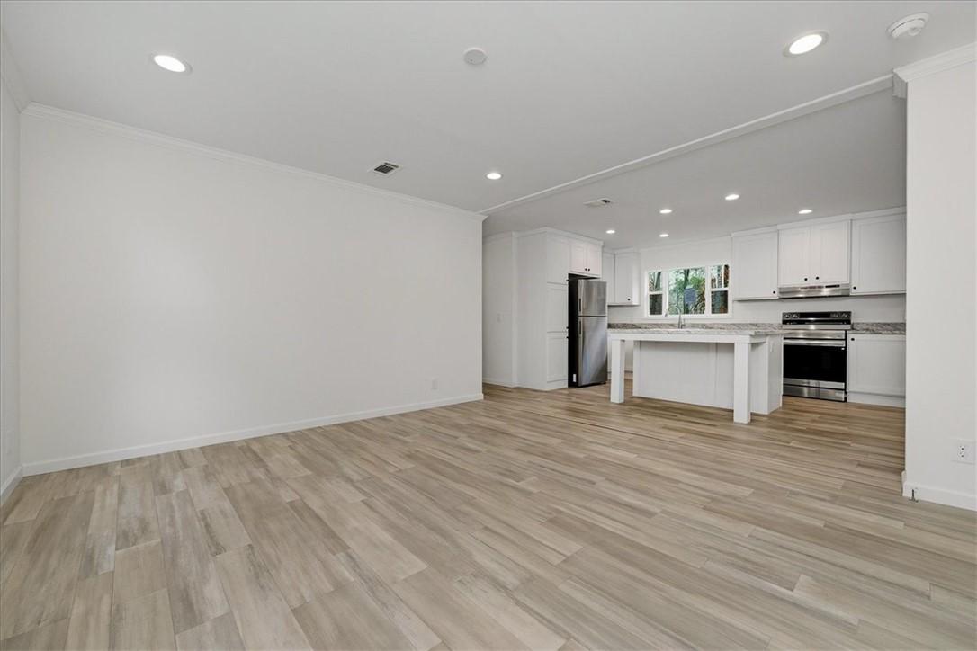 Image 4: An inviting open-concept living space features mod