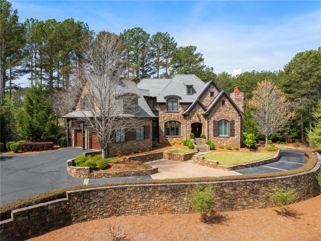 Image 1: This majestic stone estate, nestled among towering