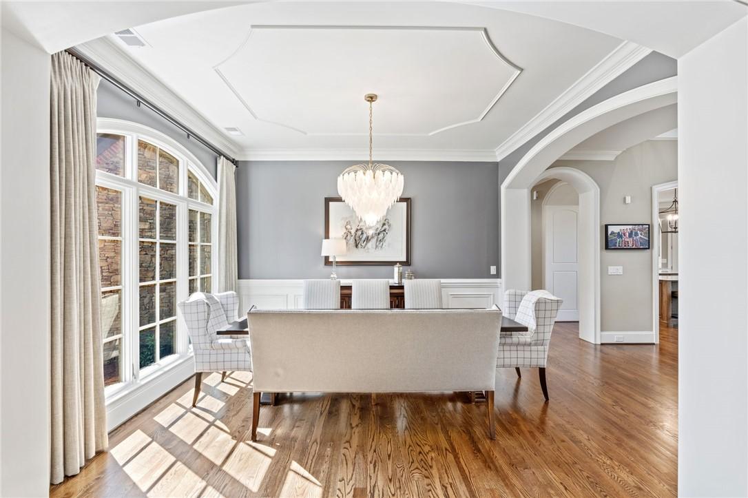 Image 3: This elegant dining room features architectural de