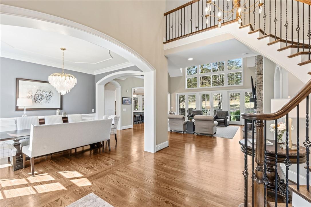 Image 4: This grand entry foyer showcases soaring ceilings,