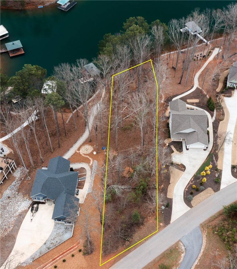 Image 1: This serene lot offers ample space for building, n
