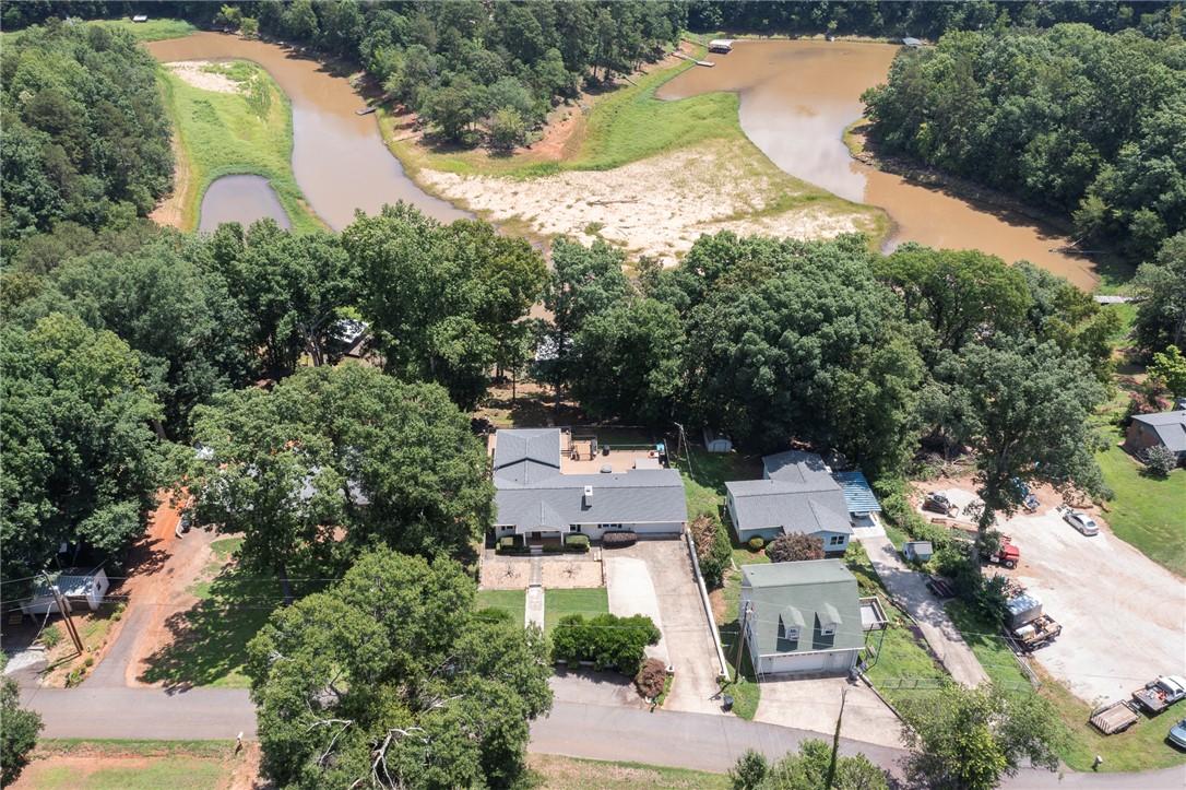 Image 1: An aerial perspective reveals a secluded lakeside