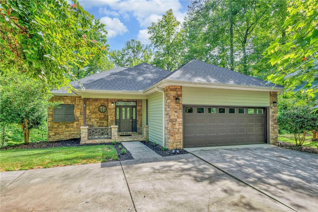 Image 2: A charming exterior with stone accents and an invi
