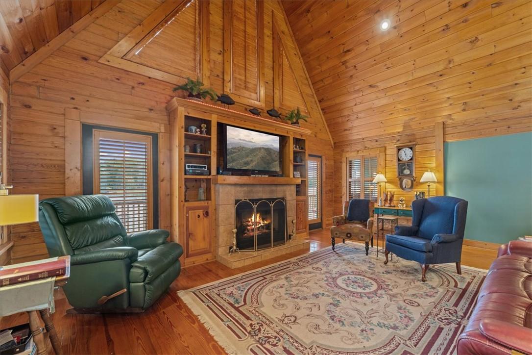 Image 3: A spacious lodge-style living room features a gran