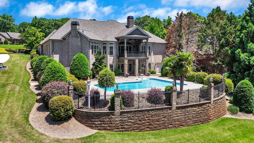 Image 2: This spacious brick estate boasts a private pool a