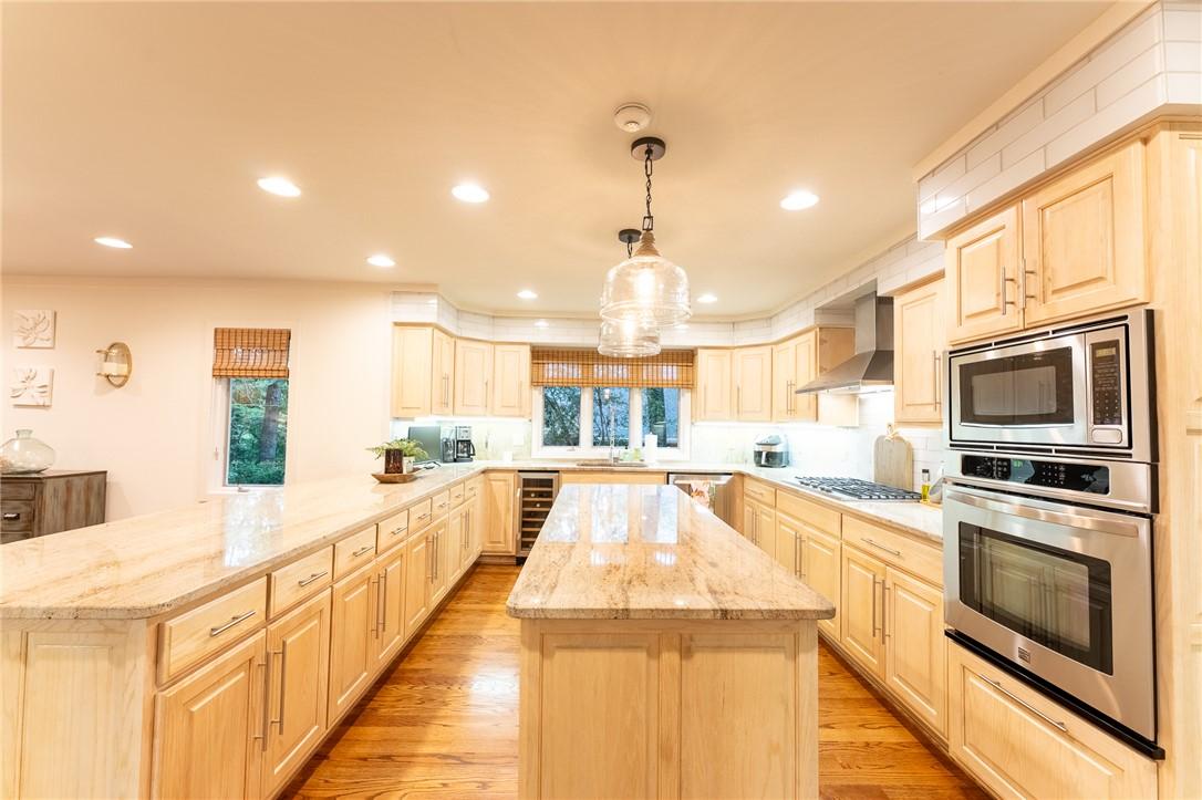 Image 2: Culinary delights await in this bright kitchen wit