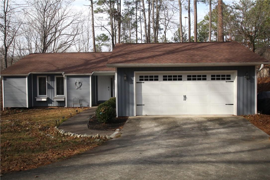 Image 2: This charming home offers curb appeal and a conven