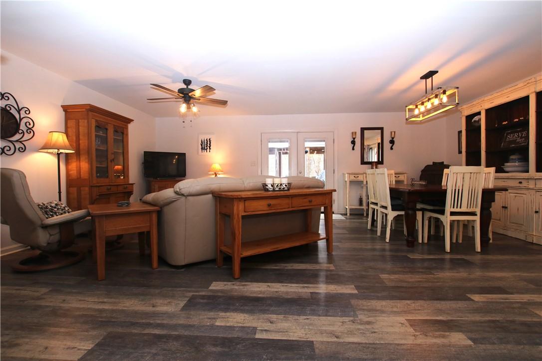 Image 3: This inviting space features durable flooring and