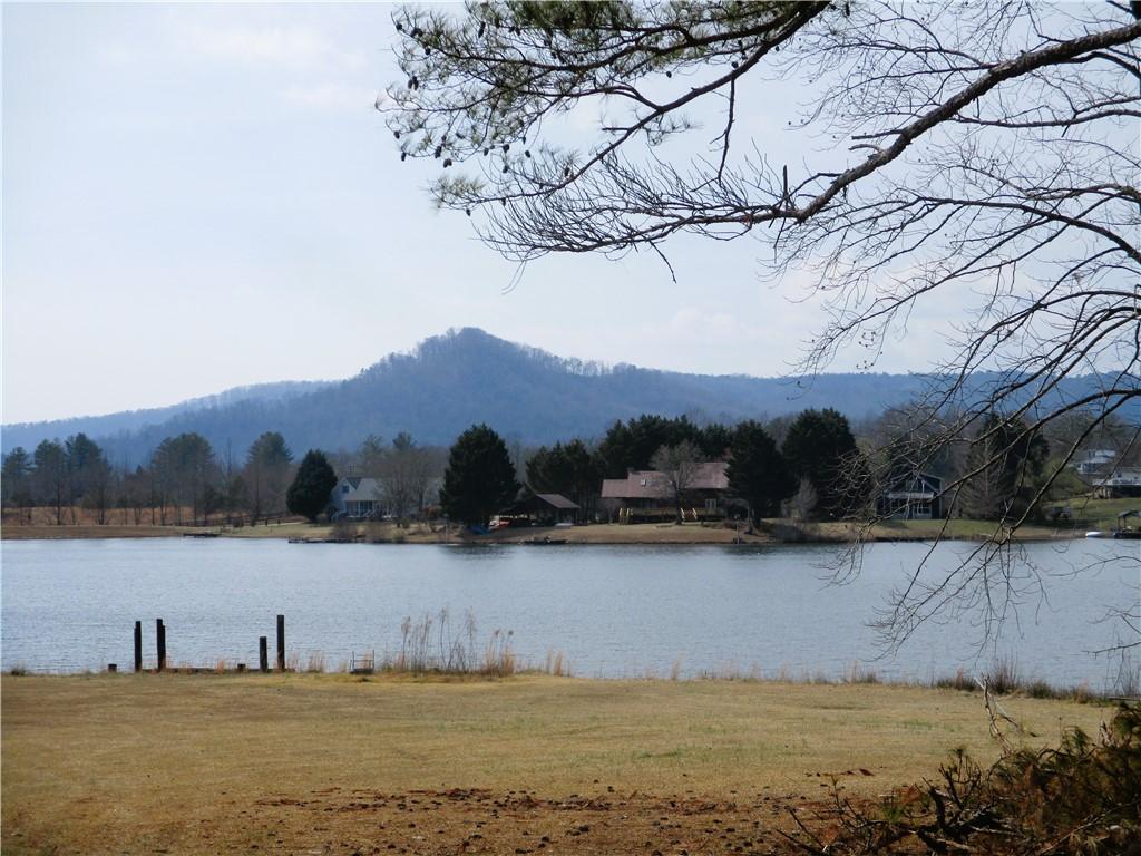 Image 1: This serene lakefront property offers tranquil wat