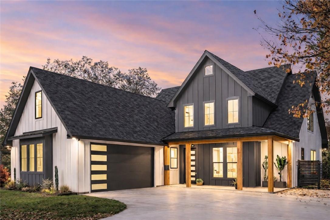 Image 2: A modern farmhouse design with a deep gray and whi