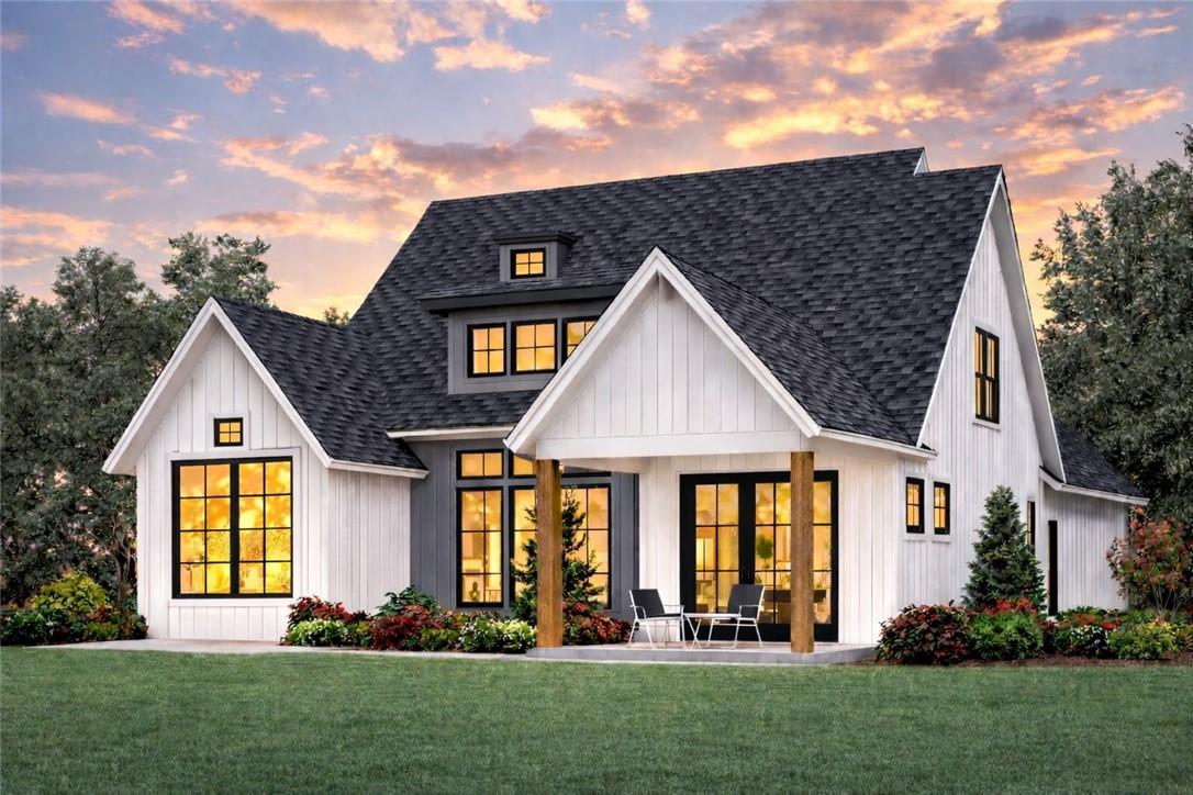 Image 3: A picturesque gabled home with striking dark windo