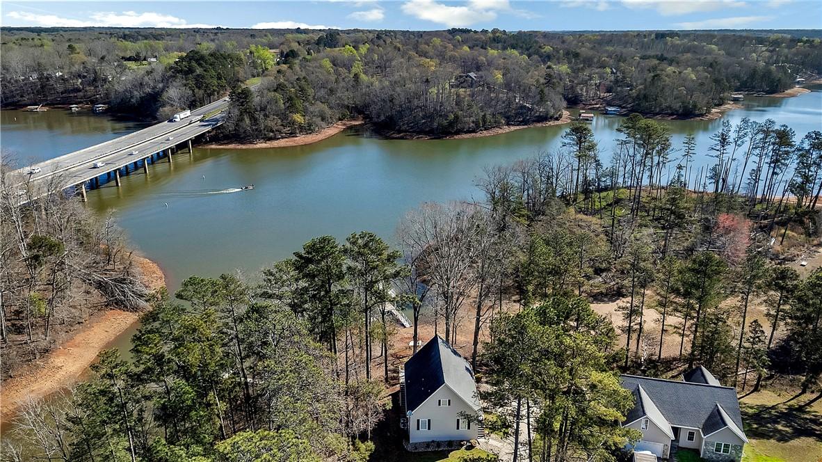 Image 2: This serene aerial view showcases a peaceful water