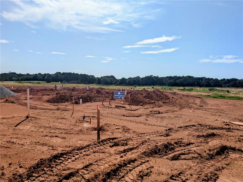 Image 2: Ready for construction, this generous lot offers a