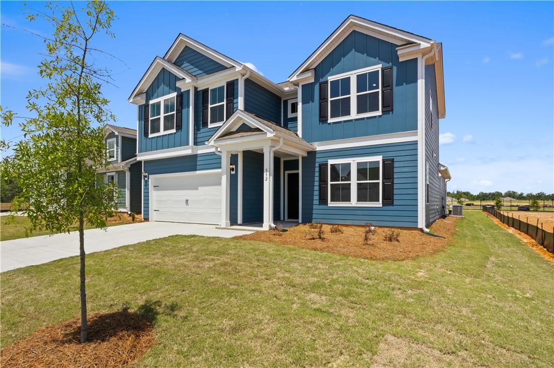 Image 2: A newly built residence with a two-car garage and