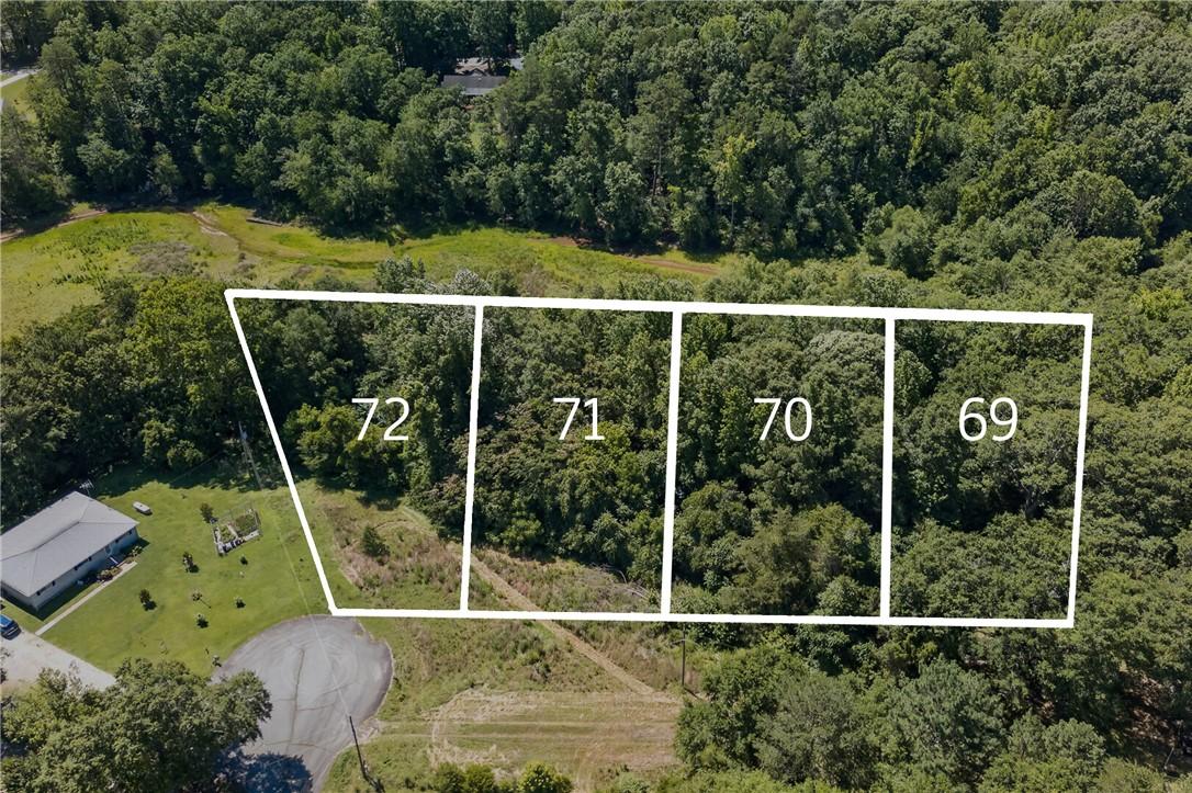 Image 1: Aerial view showcasing several subdivided, tree-co