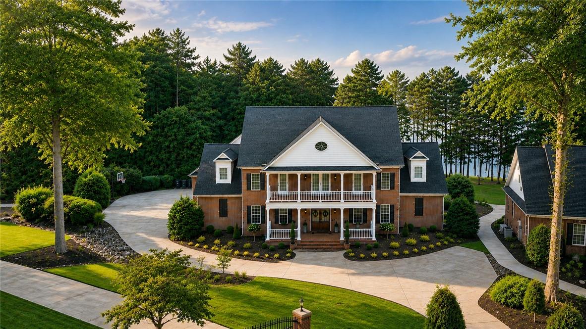 Image 1: A stately brick residence on Lake Hartwell with a