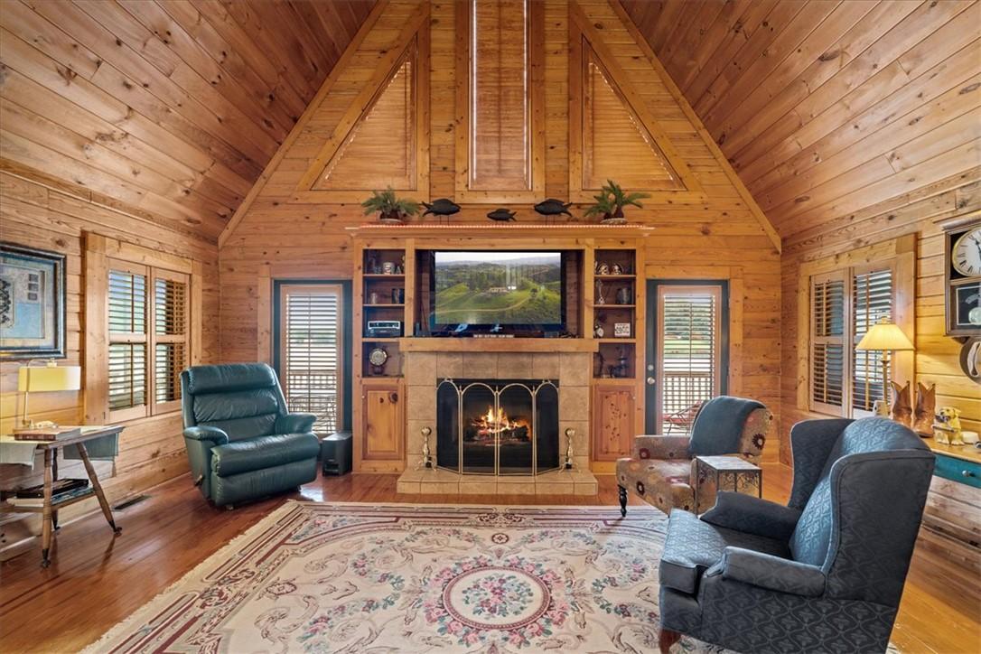 Image 4: Natural wood paneling and vaulted ceilings define
