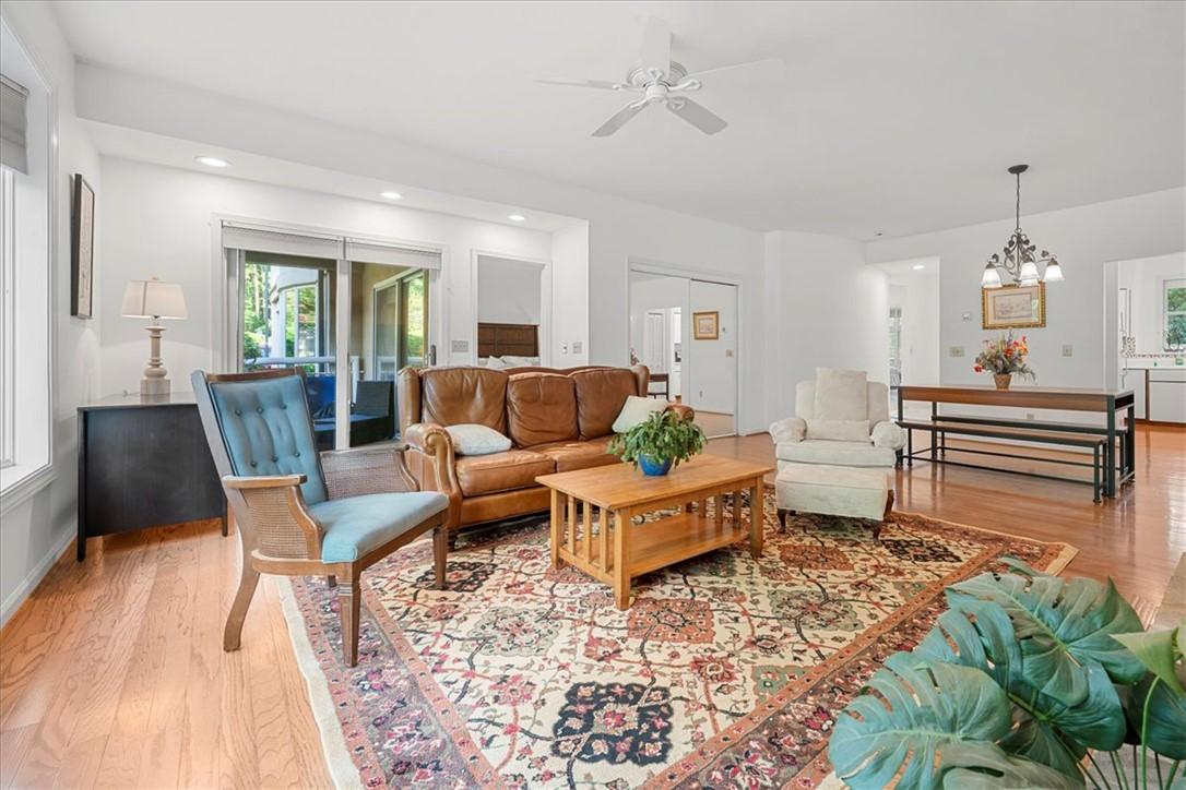 Image 4: This bright living area features abundant natural