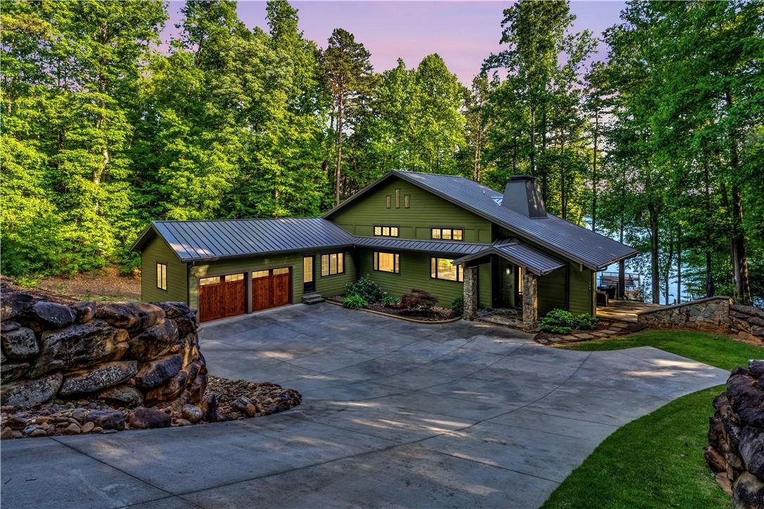 Image 4: This charming residence offers serene lake views,