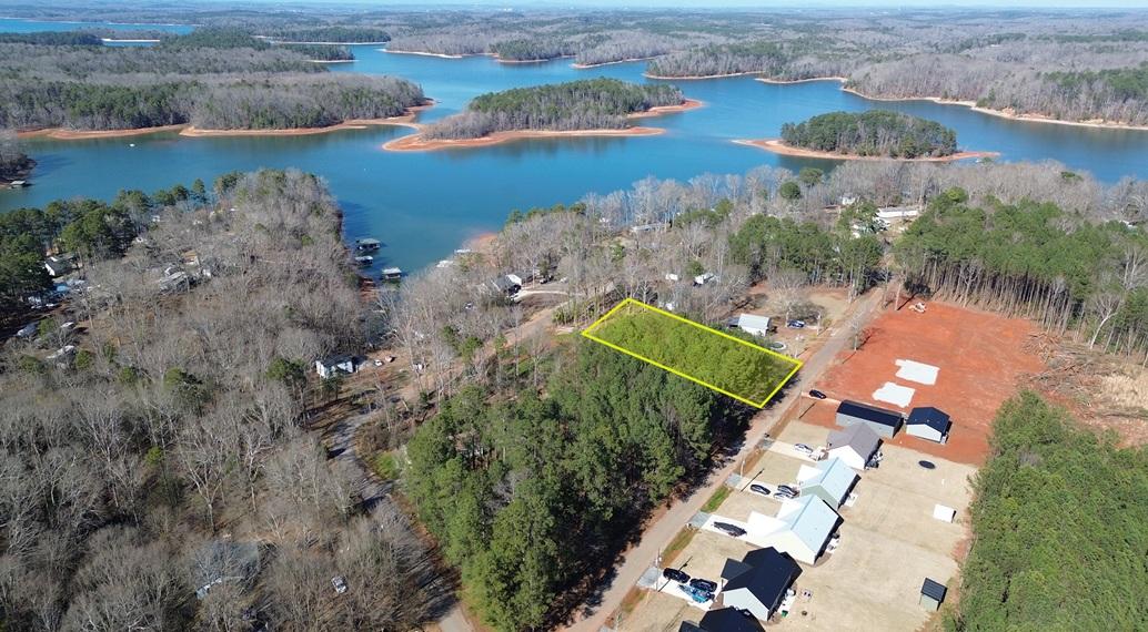 Image 3: This scenic lake view property offers a serene nat
