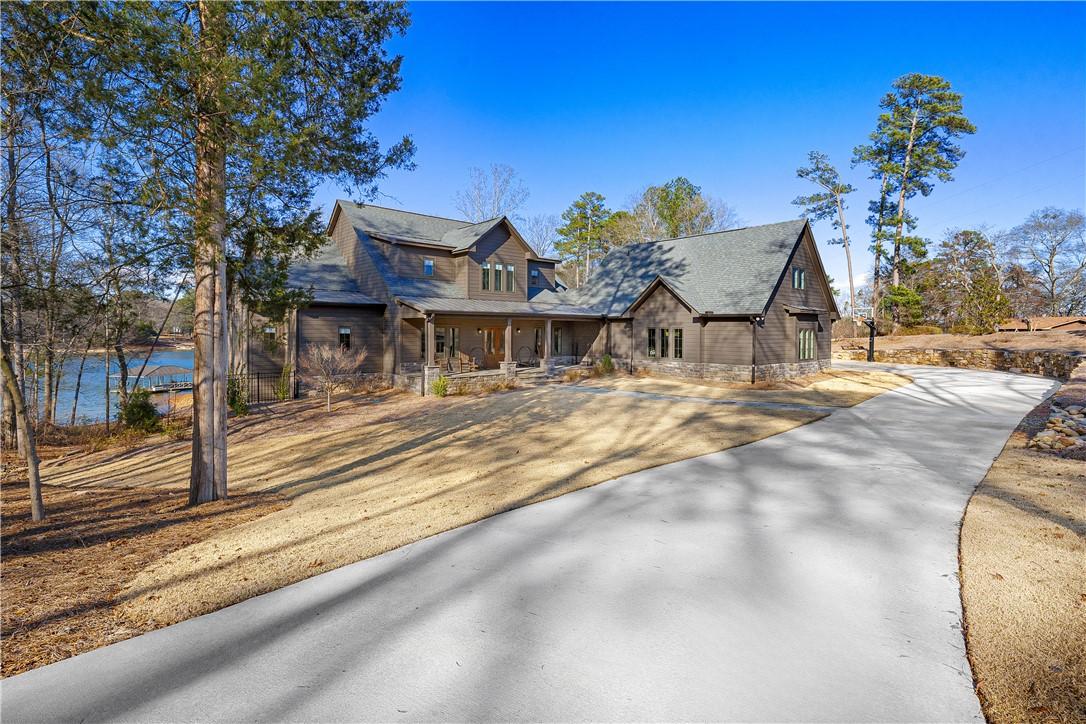 Image 2: This exquisite lakefront residence offers expansiv