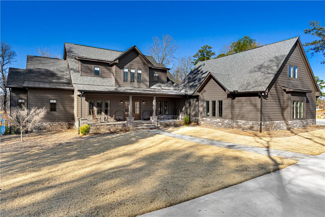 Image 3: This captivating residence boasts a welcoming porc