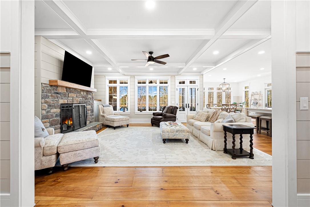 Image 4: This bright living space features abundant natural