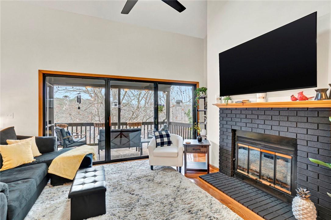 Image 4: This inviting living space features high ceilings