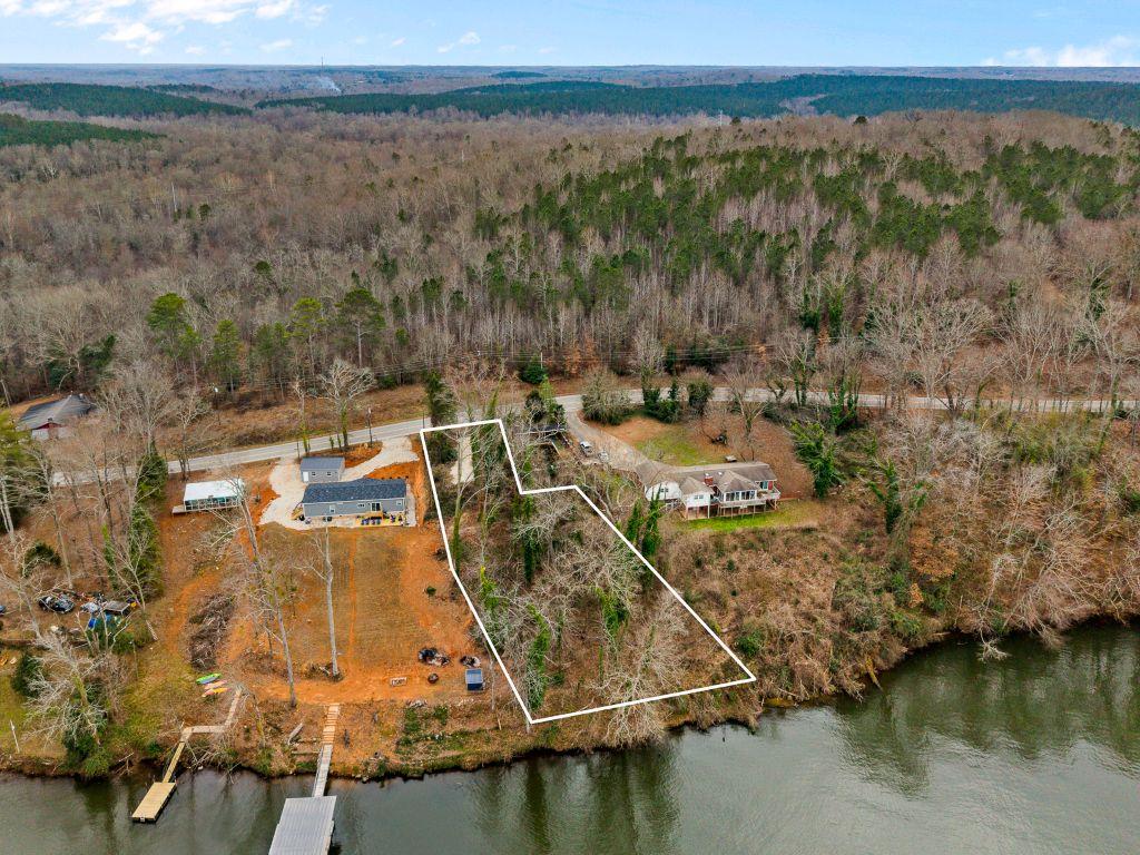 Image 1: This aerial view showcases a peaceful waterside pr