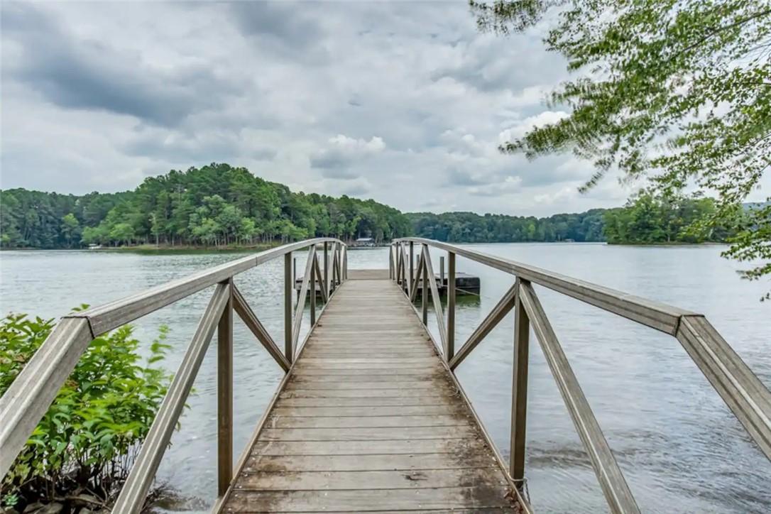 Image 4: A wooden ramp to community dock next to the boat l