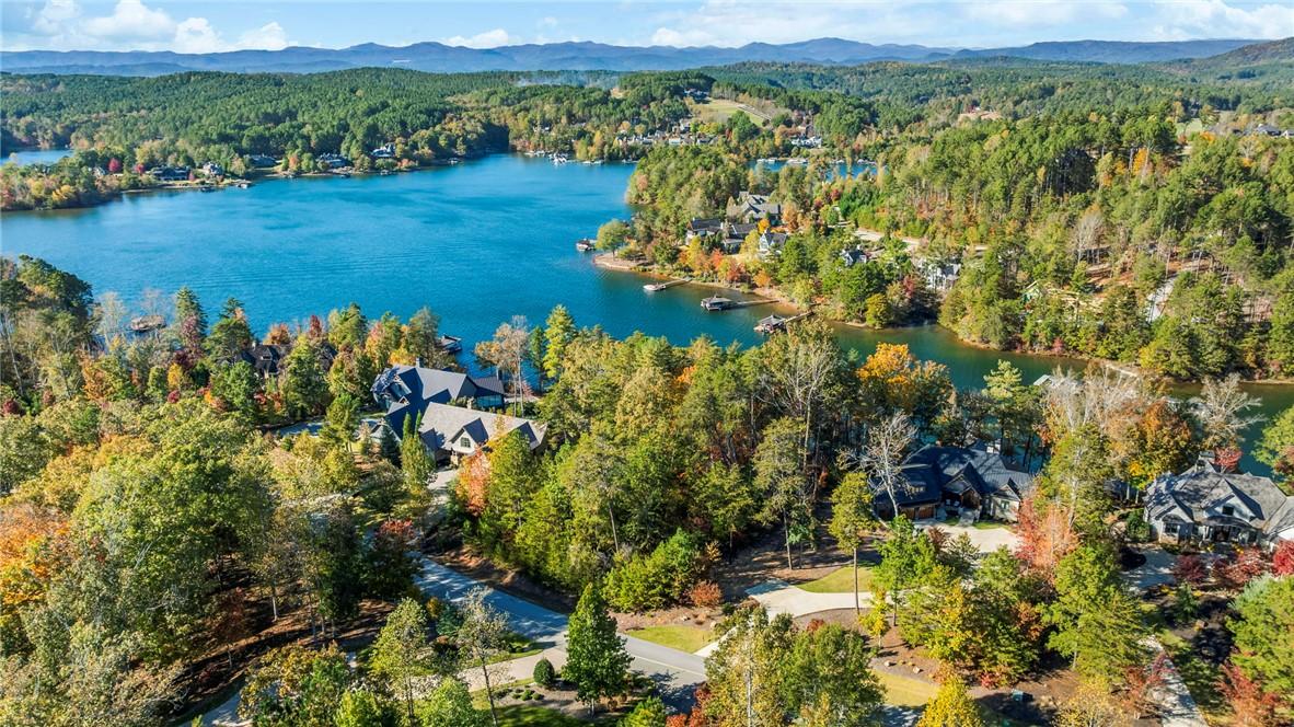 Image 2: Perched on the serene lake, this lot offers tranqu
