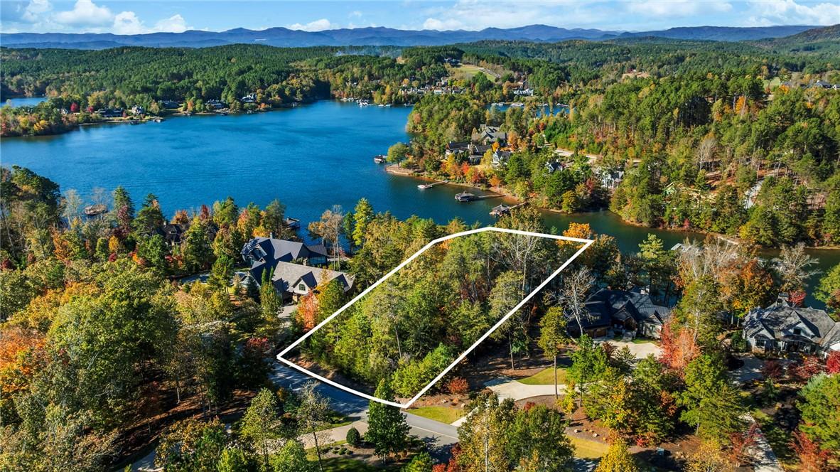 Image 3: This scenic lakefront lot offers a serene setting
