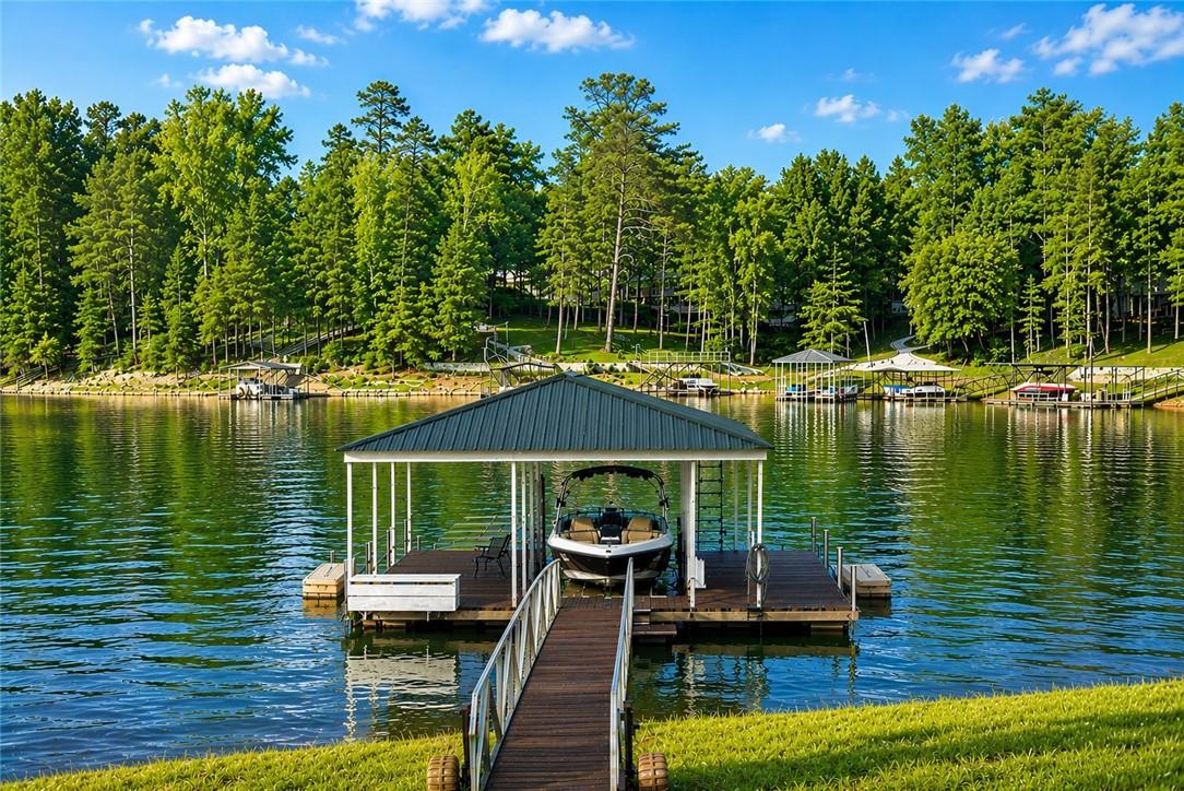 Image 4: Covered dock with Ironwood decking, boat lift and
