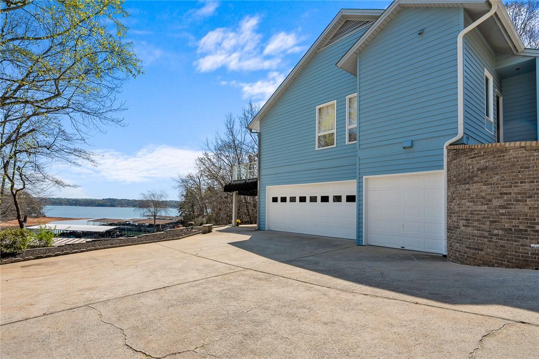 Image 2: This captivating residence boasts direct lake acce