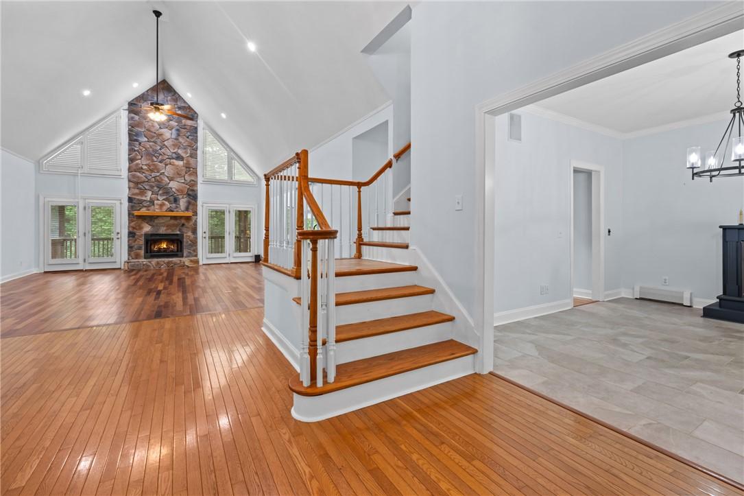 Image 2: A spacious great room showcases a floor-to-ceiling