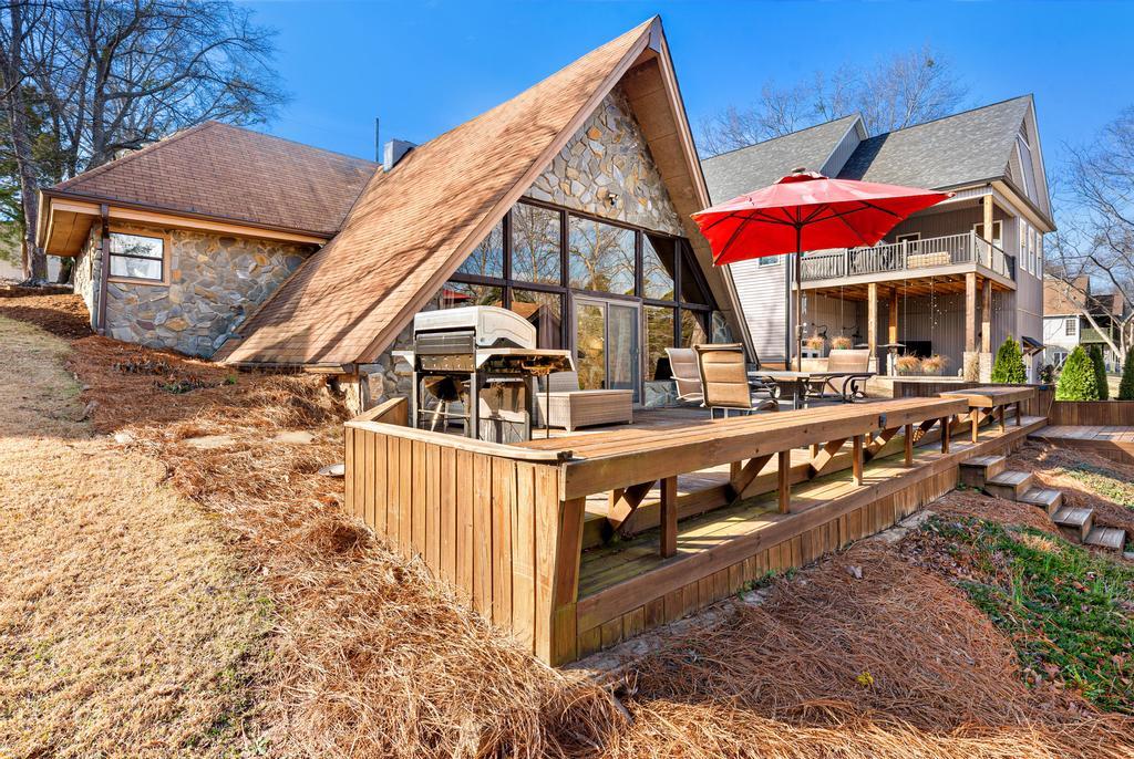 Image 2: This inviting outdoor space features a spacious wo